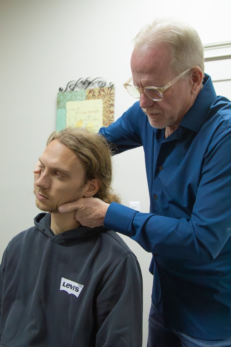 Dr. Linderman performs a gentle cervical spine adjustment in Waco to relieve tension headaches and neck pressure.